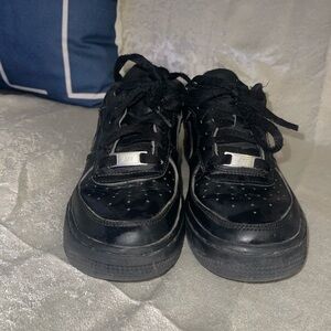 Black Nike Air Force ones sneaker with Silver Accents